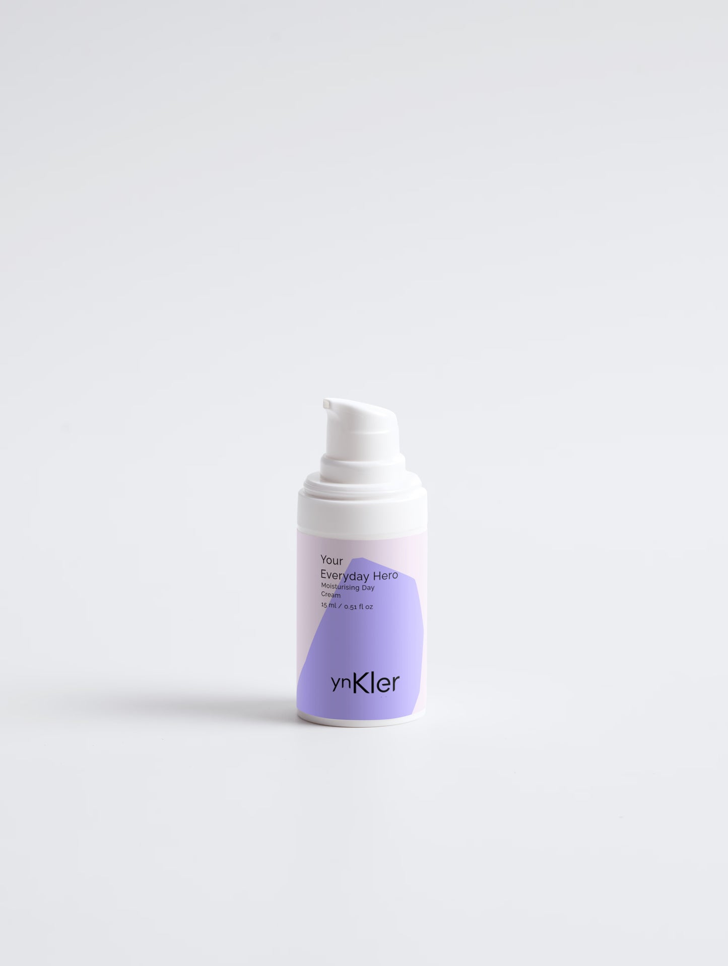 ynKler Skincare cream bottle with a white cap on a light grey background