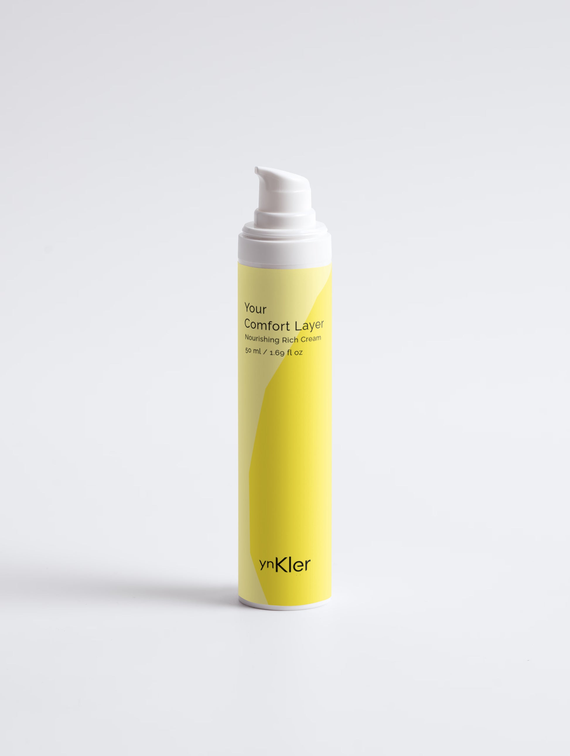 Yellow bottle of ynKler cream on a white background