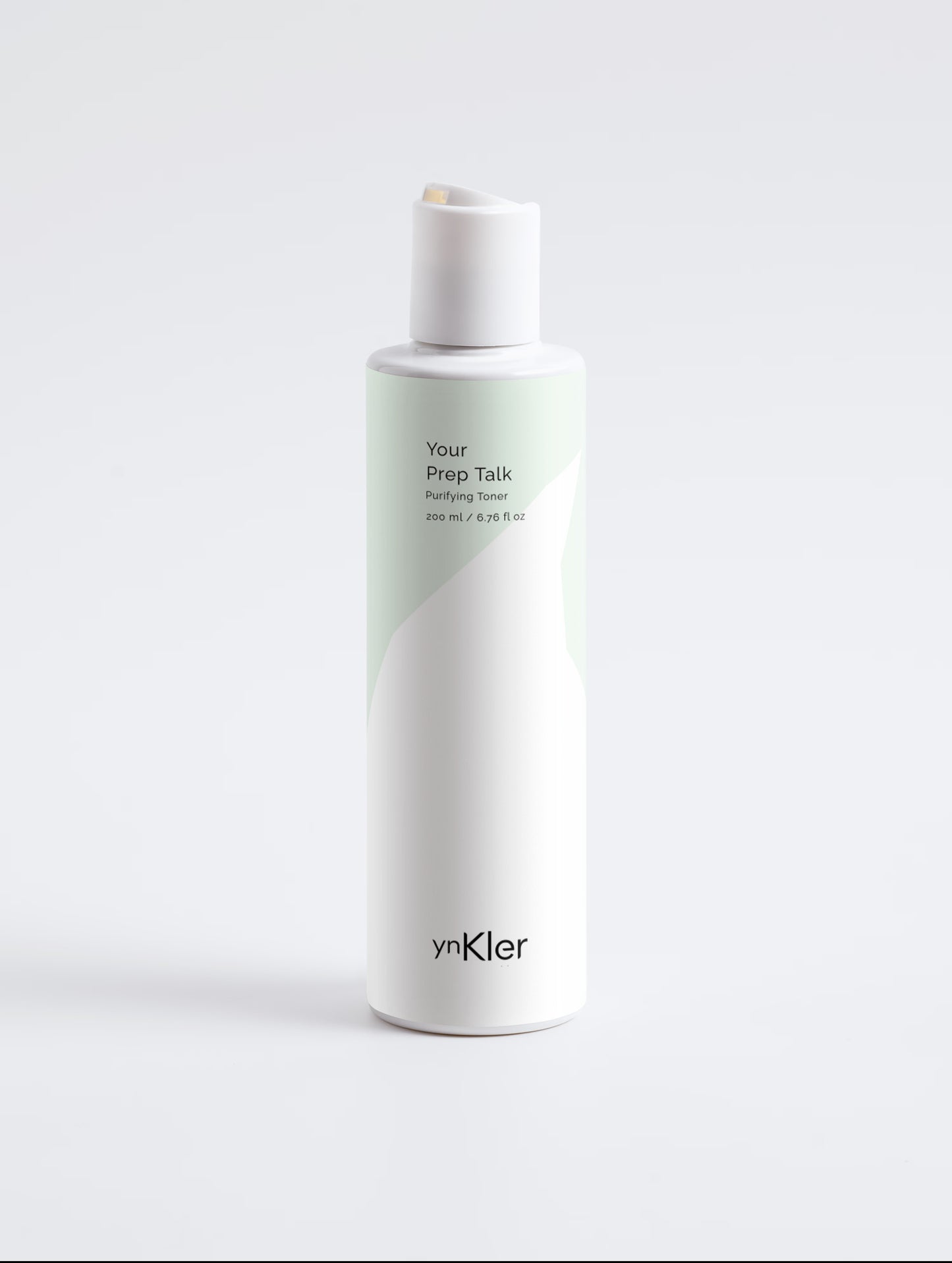 Skincare bottle labeled 'Your Prep Talk' by 'ynKler' on a light grey background