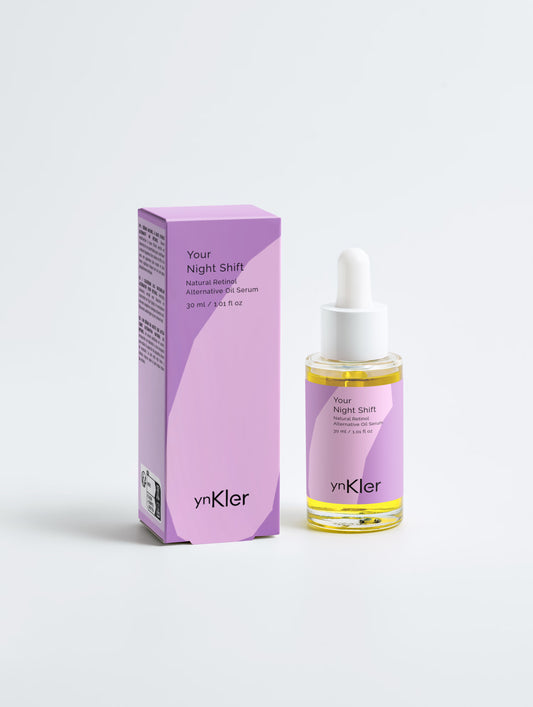 ynKler bottle and box on a light purple background