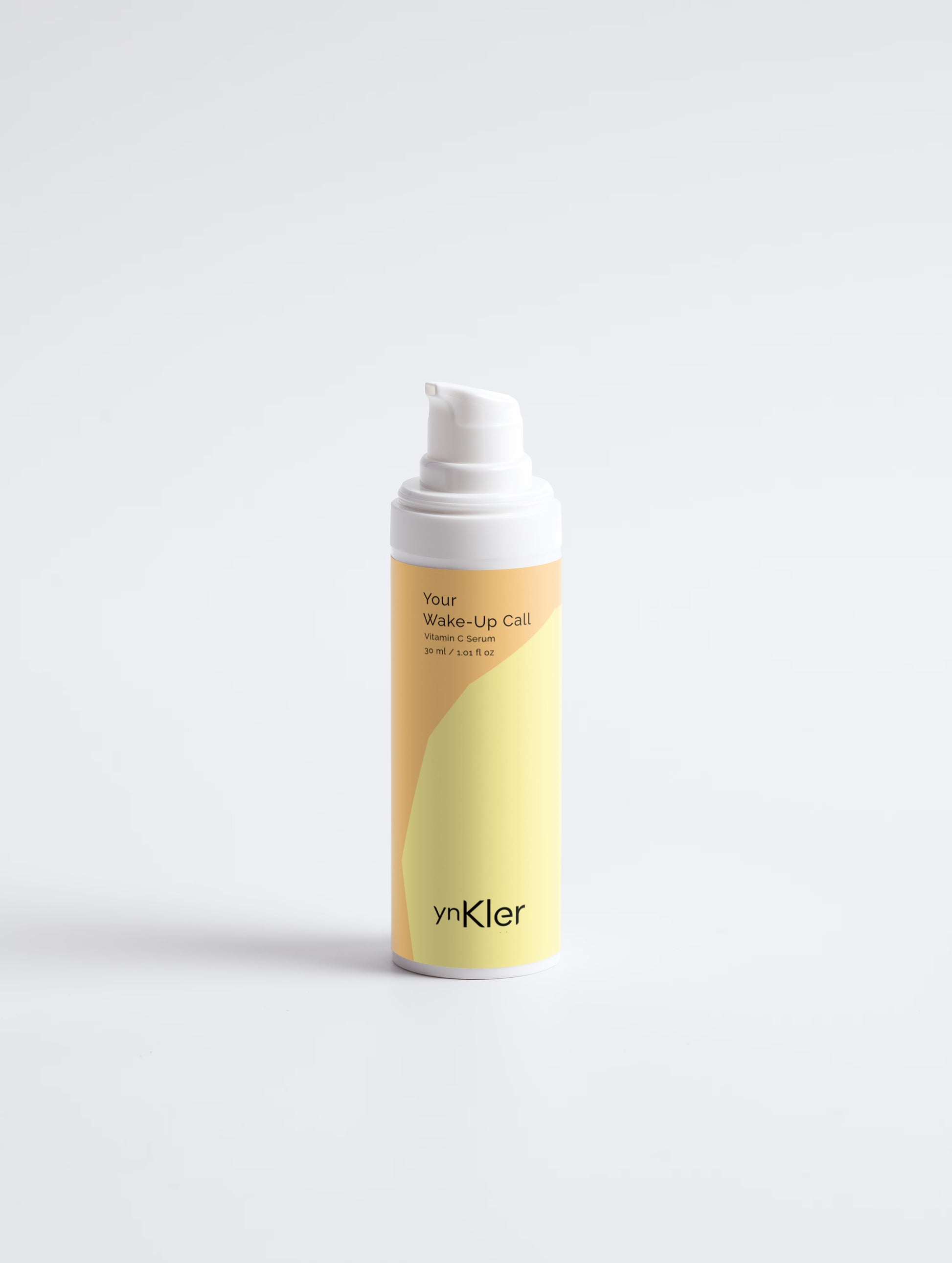 ynKler Skincare bottle with a yellow and white design on a light gray background