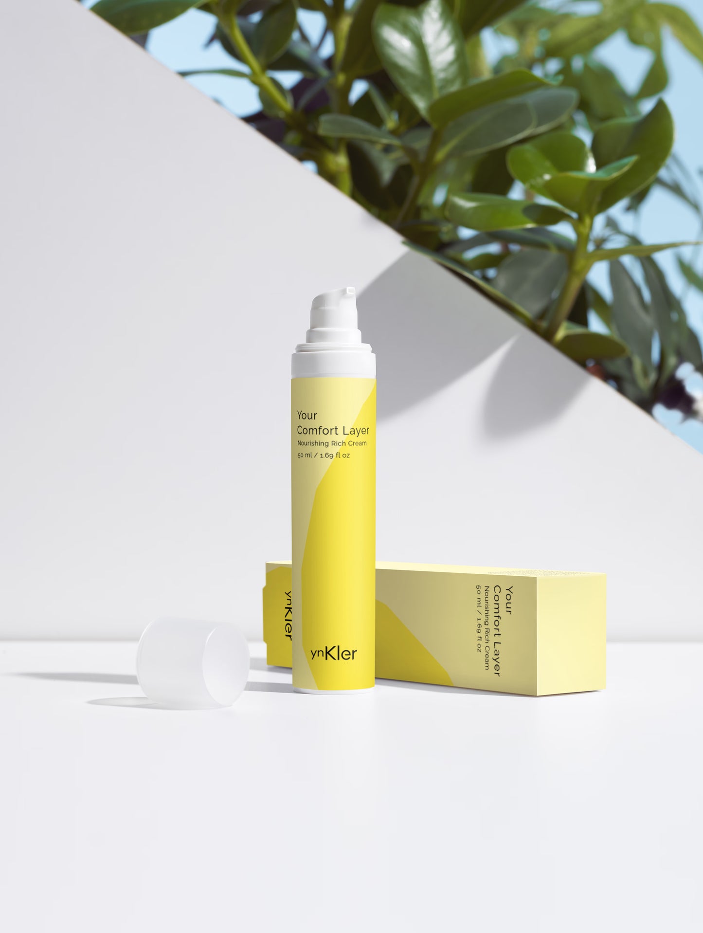ynKler Yellow skincare product with packaging on a white background